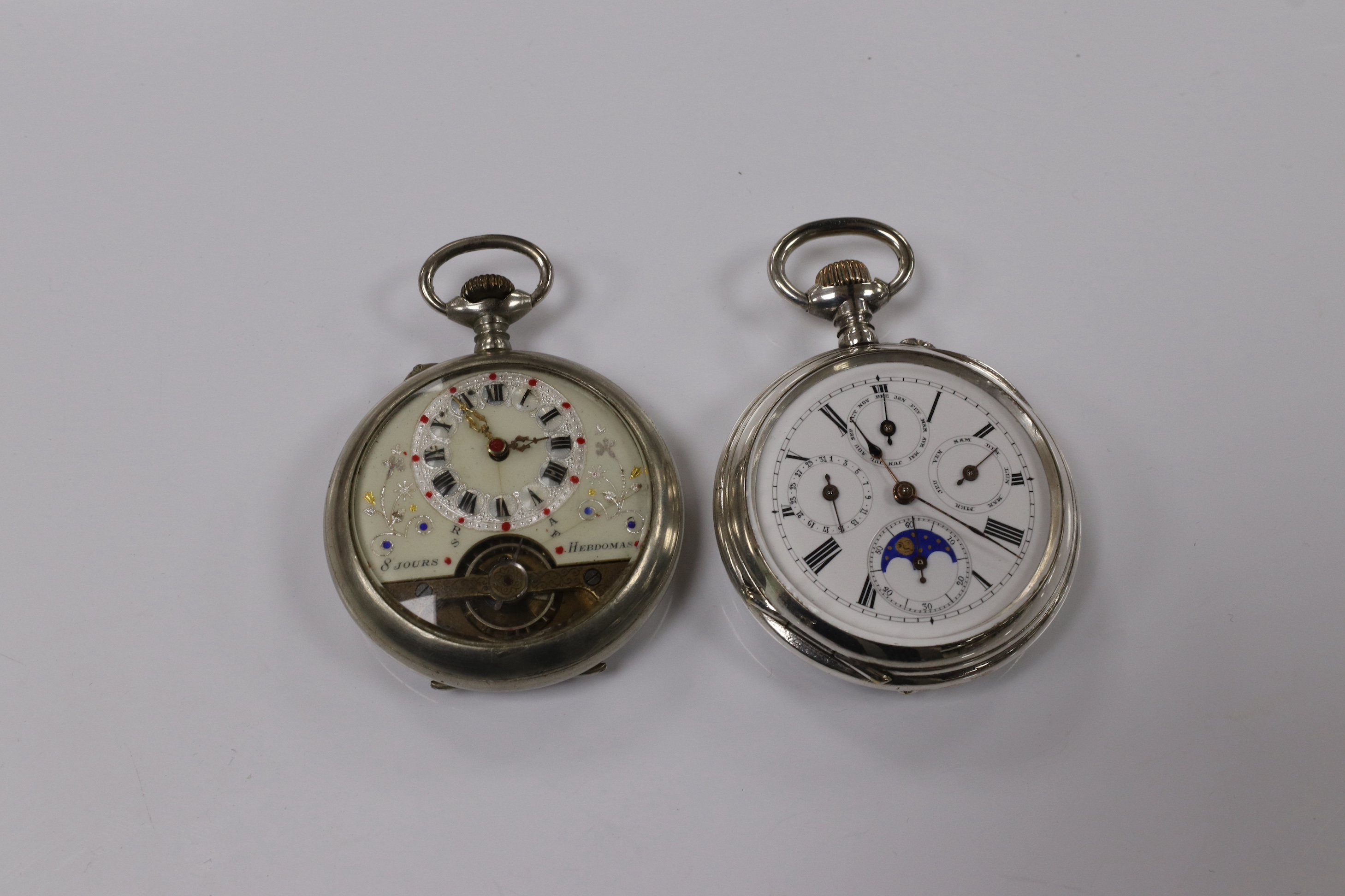 Two nickel or chrome cased pocket watches, Hebdomas, case diameter 50mm and calendar, case diameter 50mm. Condition - fair